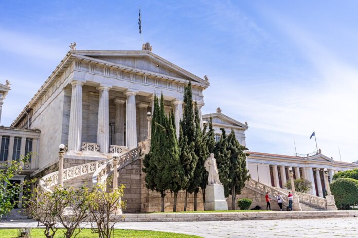 The Greek parliament has approved a law allowing 13-hour working shifts in certain cases, despite protests across the country.